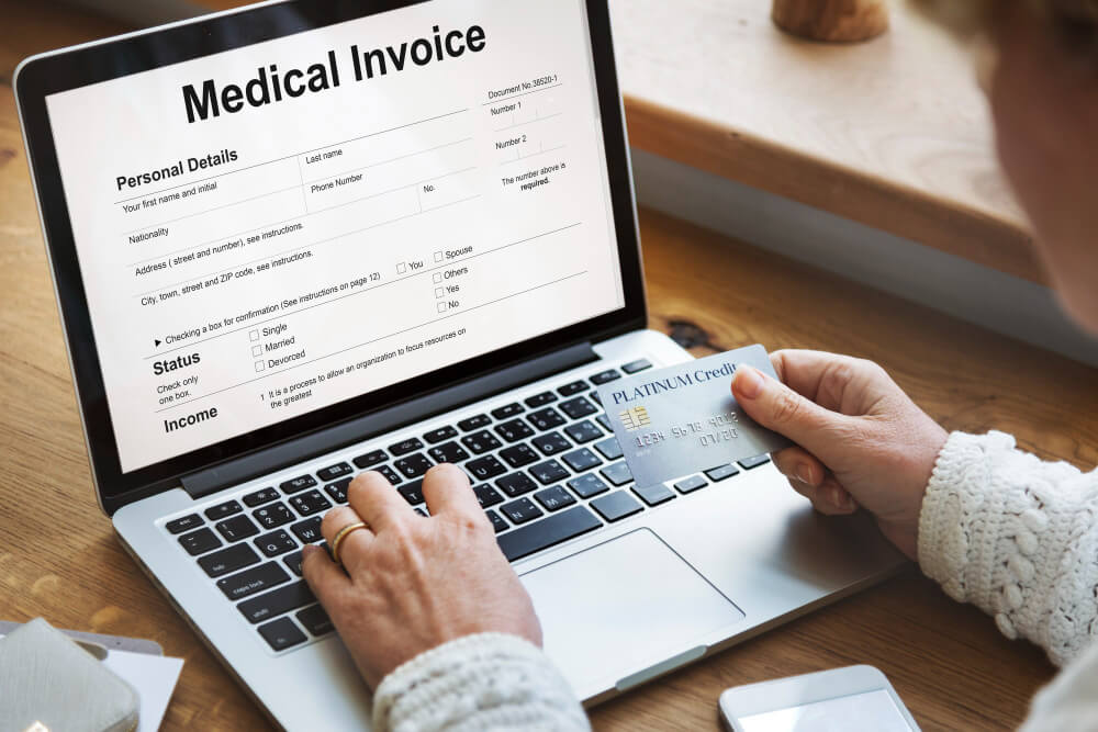 Medical billling professional reviewing medical invoice